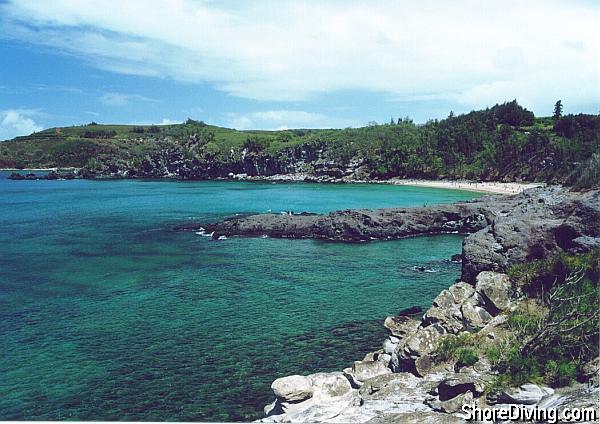 A view of the point from just South of the beach.  This view is accessible via a small dirt trail from the parking area.