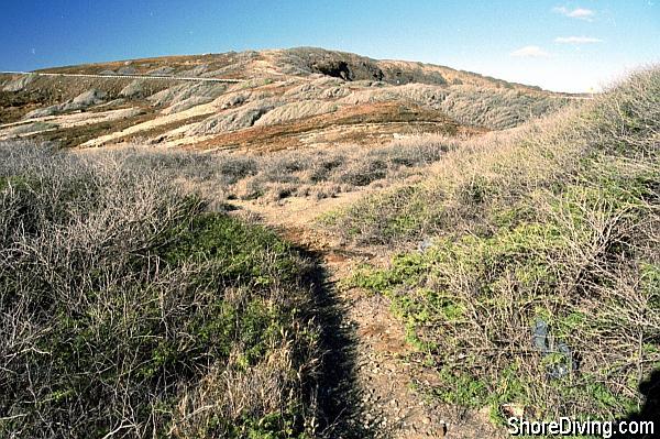 This is the trail head to the exit point, at the right of the parking lot.