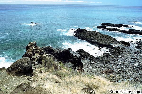 A small rocky trail leads to an entry cove.  Watch your step and carry your gear down a couple of items at a time.