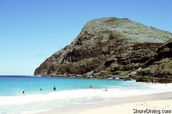 Enter at the far right of the beach, and kick out beyond the surf.