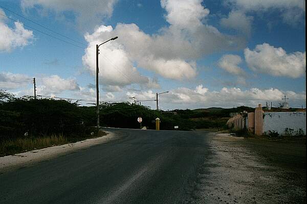 With the church on your right, bear left to proceed to Saint Marie and Daaibooi.  Go straight (West) to find Porto Marie (the road is dirt for a stretch, but then becomes a well-paved road.  Do not attempt to drive to Porto Marie from the North entry).