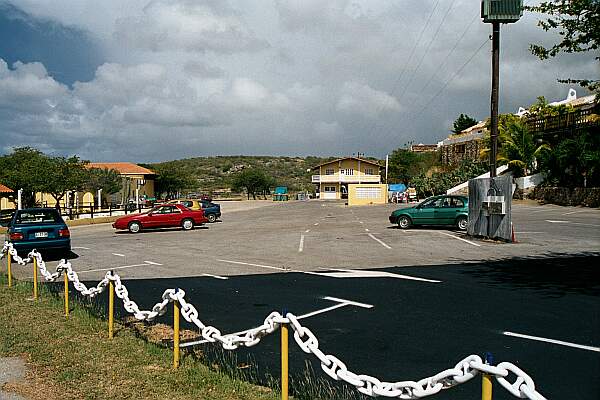 Parking is up above the beach.  The beach road is usually chained.  Ask the guard if you can drive down to drop off your equipment.