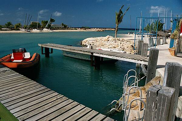 The easiest entry is off the local dive shop docks.  Check-in with them before suiting up, of course!