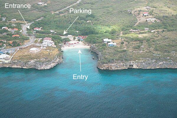 The village of Lagun is to the left.  Note your landmarks, since the coral cliffs look much the same if you surface away from the exit point.