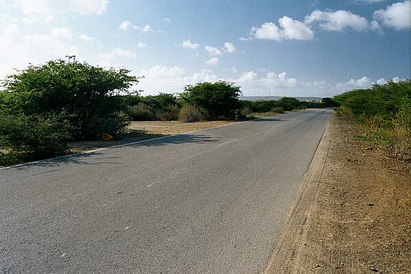 Off the main road, look for the dirt road to the West.  Travel toward the ocean until you come to a T, then turn right.