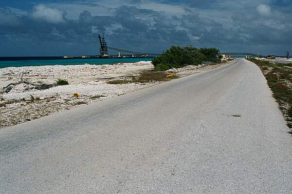 Looking North, turn left into the parking area.