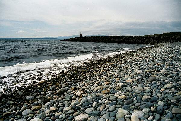 The entry is an easy walk over the smooth-stone beach.  The jetty in the background offers the most interesting underwater sights.