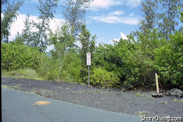 Look for this parking by the road and this small sign that marks the trail head.