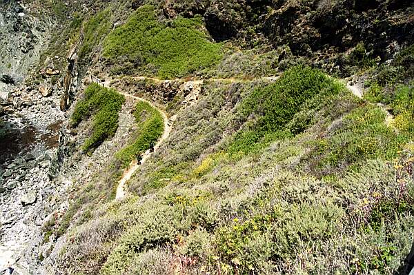 Other obstacles await you after another 150 yard down this sometimes slippery slope.  Wear your hiking boots, and carry your gear down in several trips.