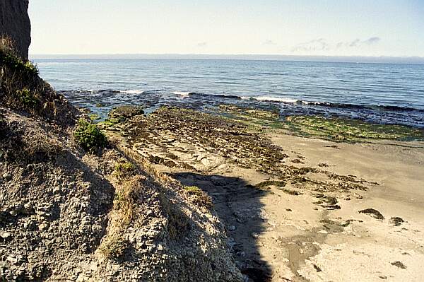 A view to the left shows the rocky structure you'll also find underwater.