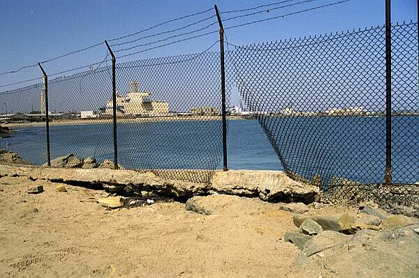 If the ocean conditions are NOT favorable, you can usually find a break in the fence, and scurry over the rocks for a protected entry.