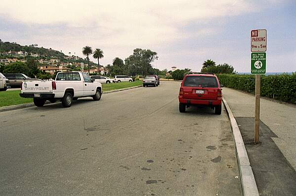 There is parking along the road and in the lot to the left.