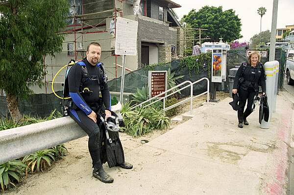 Here, two explorers rest from a good dive and a healthy climb up the stairs!