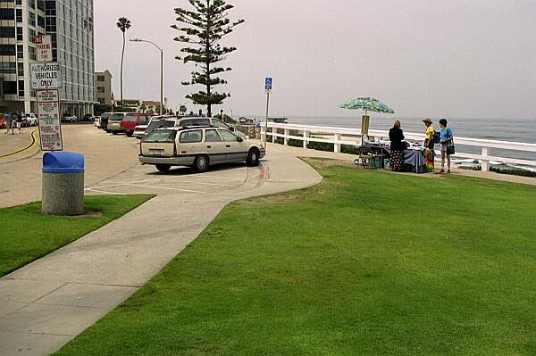 If you are lucky enough, find a spot at the South end of La Jolla Cove park.  The stairs to the beach are straight ahead.