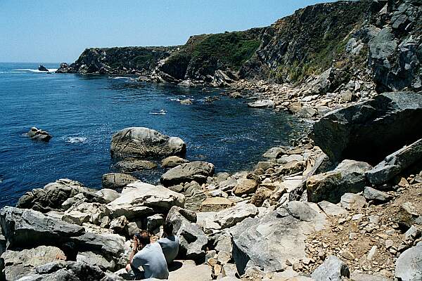 Carry your gear carefully over the rocks to a suitable entry point, and slip in!