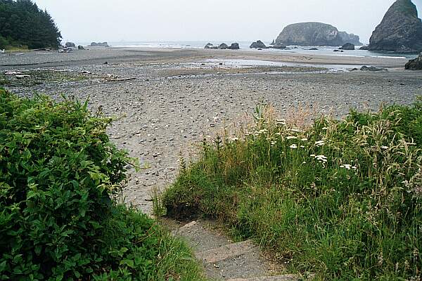 It's an easy, yet long walk from the parking lot.  You might have to get your feet wet crossing a small creek that runs through the beach.