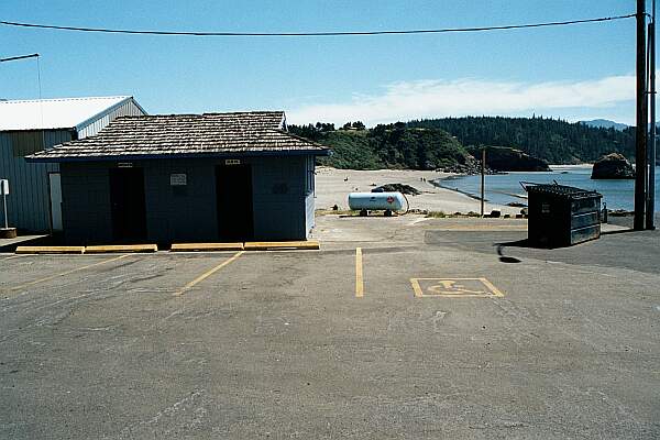 At the West end of the beach area, you'll find these restrooms and parking.  Yes, that's a shower on the side of the building!