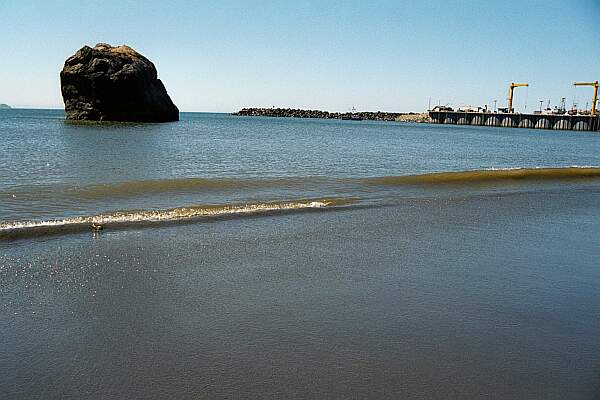 Head out beyond the rock to find clear water.