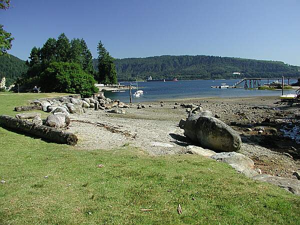 The grassy park area is to the left of the low tide flats.