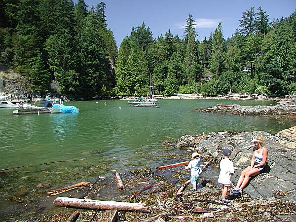 At this moment, there is a bit of debris at the water's edge.  Just help your buddy over it, and wade out slowly.