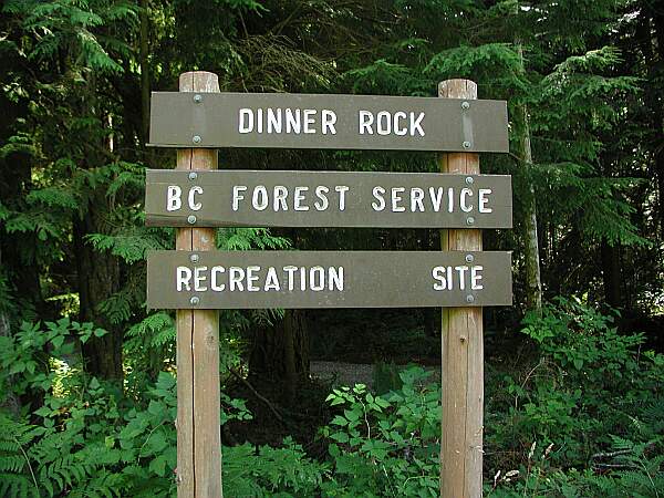 This marks the entry to a narrow, winding dirt road.  The road is well-maintained, so your car should not have any problem.