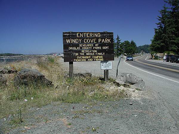 You'll be entering from the road ahead of you.  Parking is behind the sign.