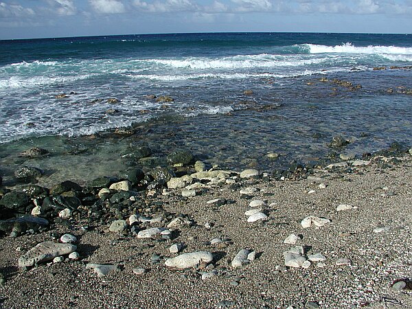 Notice the uneven bottom strewn with small ankle-twisting rocks.  Wear good booties, and use your buddy to keep your balance while you walk to deeper water.