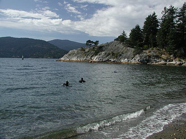 Two divers are seen braving the cold.  For clearer, less crowded waters, head out toward the Western point in the background.