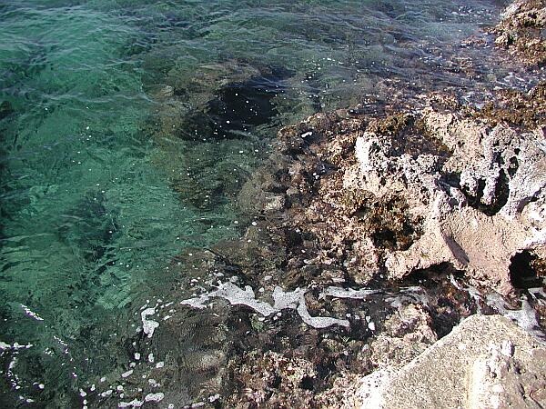 You enter the water by stepping down the platform onto a couple of natural lava steps.  Then just slip gently into the water.  On a calm day, you can actually exit from this spot, but if there is any surge at all, do not attempt it!  It would ruin your day and your vacation to be pounded onto the lava by an unexpected swell!