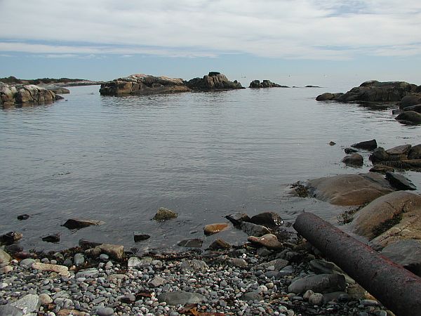 The entry can be rocky, so watch your step, and swim carefully out through the openings. Keep an eye on your land marks for an easy return, note any current outside the rocks, carry a flag with you, and watch out for the lobster fishermen above.