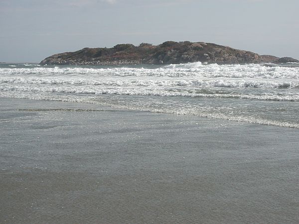 Wait until low tide so you can walk out to the island.