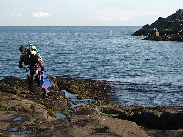 Be careful, especially during low tide, of slippery rocks.  You'll never know what hit you if you take a spill with 50 pounds of gear on.